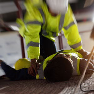  A man lies on the floor, illustrating workplace safety concerns in Monterey County, California